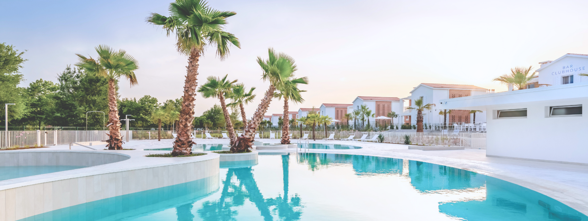 Pareus Beach Resort - with Caribbean pool landscape and family homes.