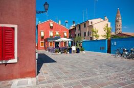 Picture Caorle with its colourful houses, restaurants and cafes attracts holiday makers.